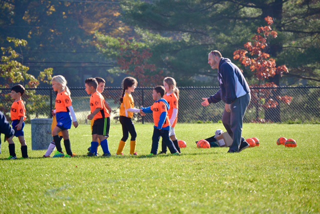 Coach with his team